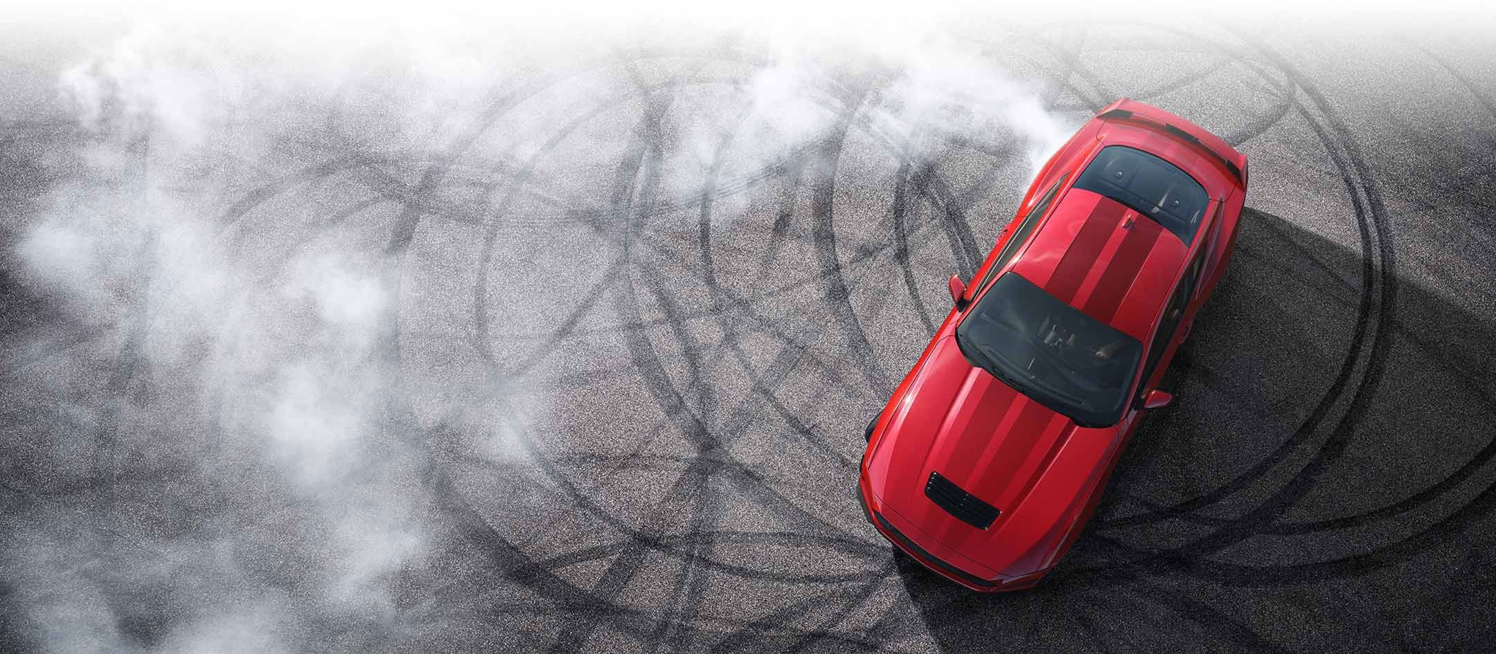 Overhead view of a 2024 Ford Mustang® model with tire tracks on pavement | Lundgren Ford in Eveleth MN