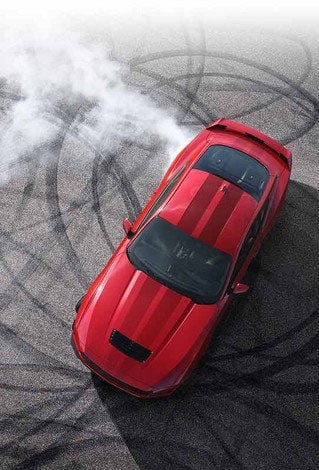 Overhead view of a 2024 Ford Mustang® model with tire tracks on pavement | Lundgren Ford in Eveleth MN